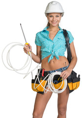 Woman in hard hat and tool belt holding coil of cable
