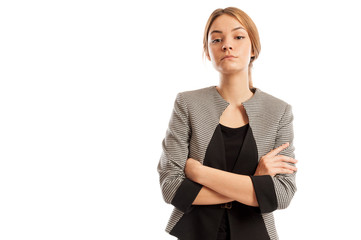 Confident business woman with arms crosses and head up