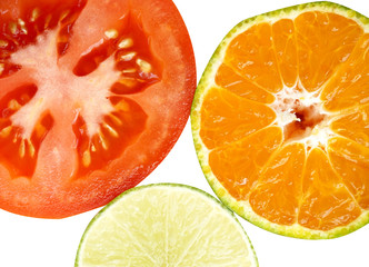 Close up of orange, tomato and lemon on white background