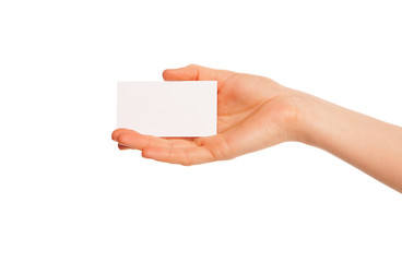 one hand holding a white piece of cardboard.