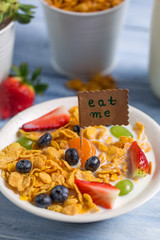 Enjoy your breakfast with cornflakes and fruits