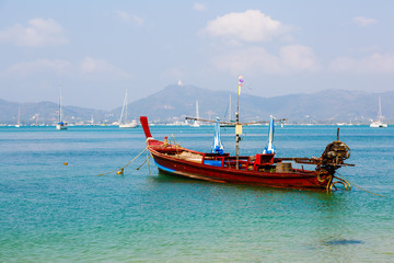 Naklejka na ściany i meble landscape the sea, the boat in a bay of a chalong