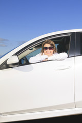 Car. Woman driver happy smiling