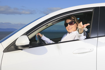 Car. Woman driver happy smiling