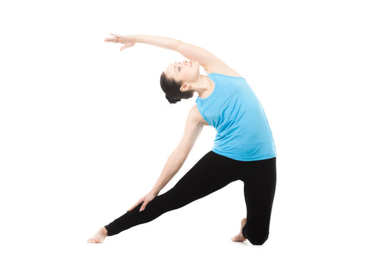Yogi female in yoga asana Parighasana