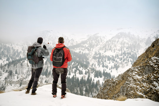 Hikers admiring the winter landscape