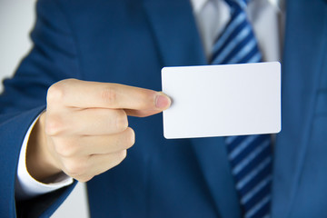 Man hand holding a business card