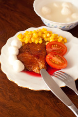 Dish with fried meat and sauce