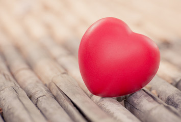 Fototapeta premium Red heart in Valentines with wood background.