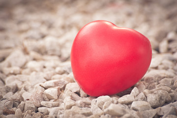 Fototapeta premium Red heart in love of Valentine's day with white stone background
