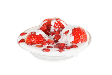 strawberries with cream and pomegranate seeds