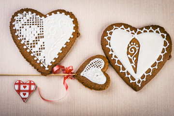 home made cookies in shape of hearts covered with white icing