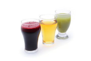 Fresh fruit and vegetable juices on white background