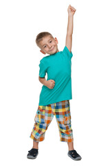 Successful little boy against the white