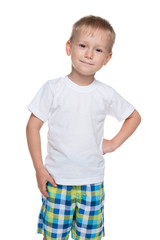 Smiling little boy in a white shirt
