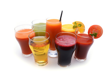 Fresh fruit and vegetable juices on white background
