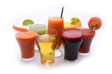 Fresh fruit and vegetable juices on white background