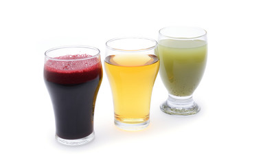 Fresh fruit and vegetable juices on white background