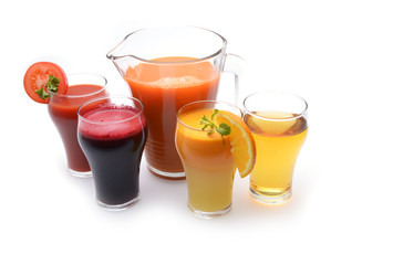 Fresh fruit and vegetable juices on white background