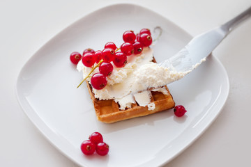 Plate of belgian waffles with cream cheese