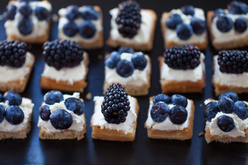 Plate of small waffles with cream cheese