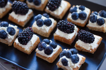 Plate of small waffles with cream cheese