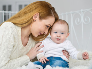 Portrait of happy mother and baby