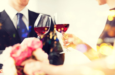 engaged couple with wine glasses
