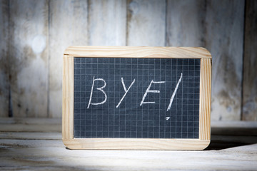 Bye written on blackboards
