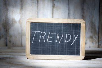 Trendy fashionable term written on blackboards