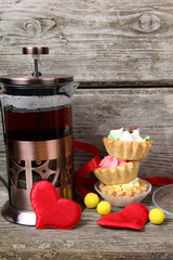 Cup of tea, cakes and red hearts