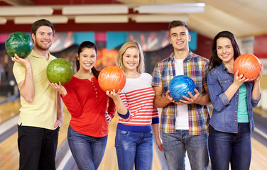 happy friends in bowling club