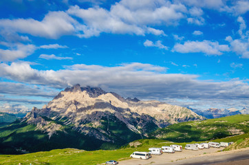 Fototapeta na wymiar Campers in the parking near shelter Auronzo, South Tyrol, Italy