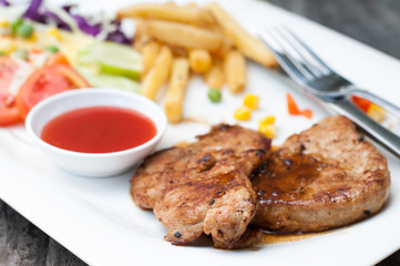 Succulent thick juicy portions of grilled fillet steak served wi