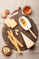 Assorted cheese,  grissini bread sticks, honey and nuts