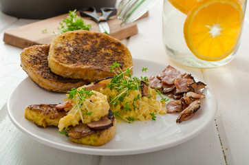 Scrambled eggs with French toast topped with watercress
