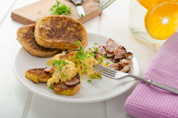 Scrambled eggs with French toast topped with watercress