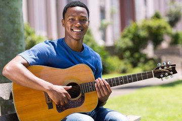 young african american man playing guitar