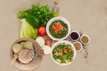 Plates of traditional Arabic salad fattouch and tabbouleh