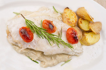 Fish dish - fish fillet in sauce and vegetables