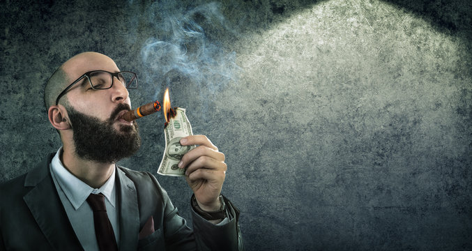 money burning - businessman arrogant