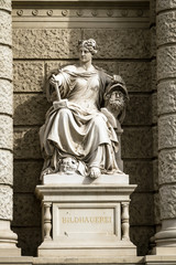 Fototapeta na wymiar Stone sculpture of a woman in the the center of Vienna, Austria