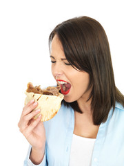 Young Woman Eating a Donner Kebab