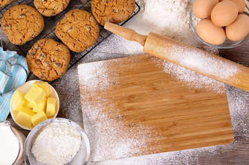 Baking cooking making biscuit cookies with ingredients chopping board and equipment background with...