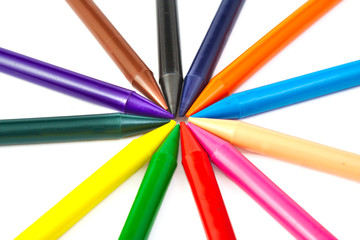 Fototapeta premium Set of wax crayons pointing to the center on white background.