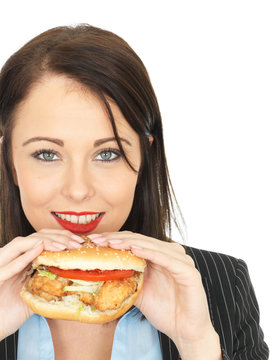 Young Business Woman Eating A Chicken Burger