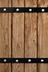 Background of wooden boards with iron mountings