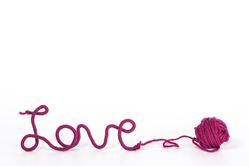 word love of red thread on white background