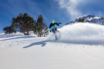 Snowboarder moving down