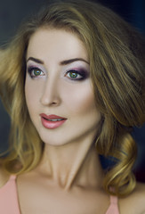 Naklejka premium Emotive portrait of young beautiful woman with long blonde hair.